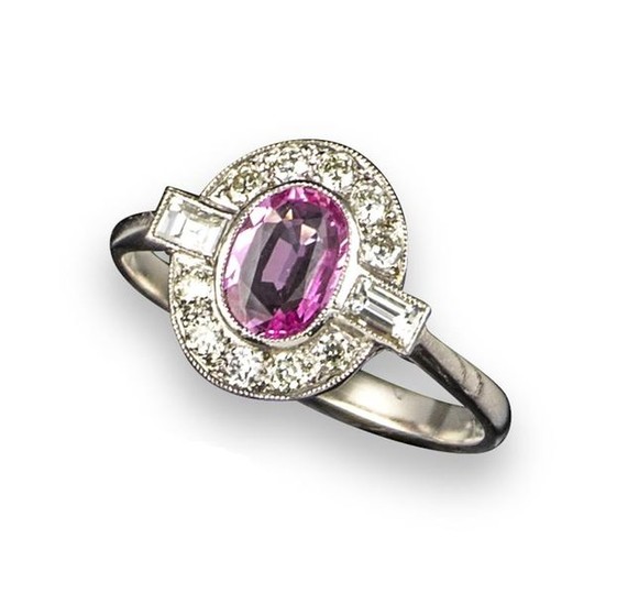 A pink sapphire and diamond cluster ring, the...