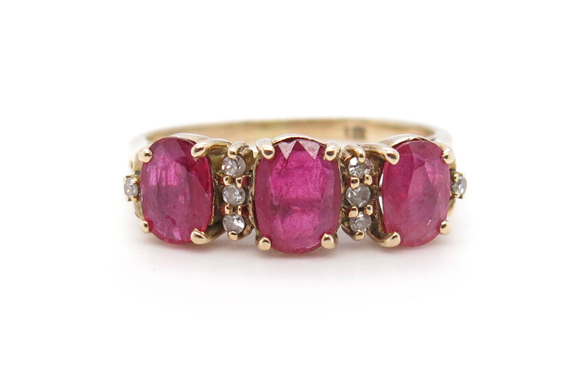 A ruby and diamond three-stone ring