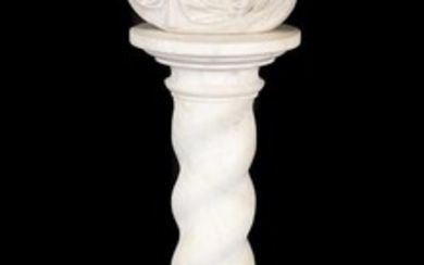 A sculpted white marble bust of a lady