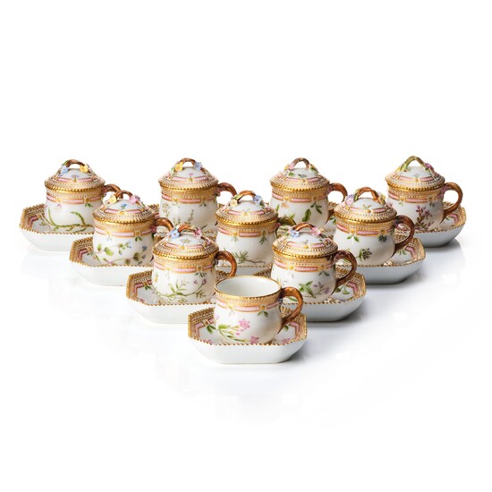 A set of 9 Royal Copenhagen 'Flora Danica' custard cups with stands, Denmark, early 20th Century.