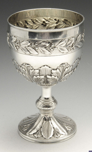 A silver goblet or chalice.