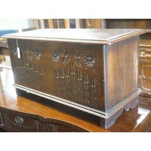 A small 17th century style carved country oak coffer, width ...