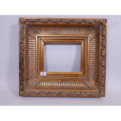 A 'Carvers & Gilders' heavy gilt frame with composition mou...