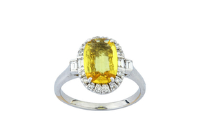 A yellow sapphire and diamond cluster ring Set...