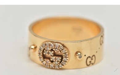 AN 18CT GOLD 'GUCCI' ICON BAND RING, a wide yellow metal ban...