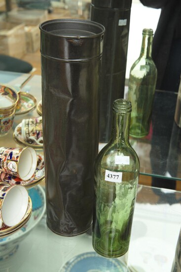 AN ANTIQUE FRENCH WINE EXCISE BOTTLE IN ORIGINAL METAL CYLINDER WITH LID