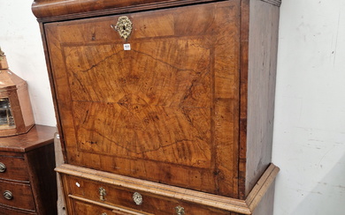 AN EARLY 18th C. WALNUT DROP FRONT BUREAU CHEST, AN OVOLO FRONT DRAWER ABOVE THE FALL, THE BASE WITH
