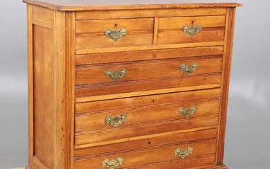 AN EDWARDIAN SATIN WALNUT CHEST OF TWO SHORT AND THREE LONG DRAWERS.