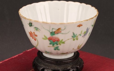 An 19th century Chinese fluted circular bowl, painted in the...