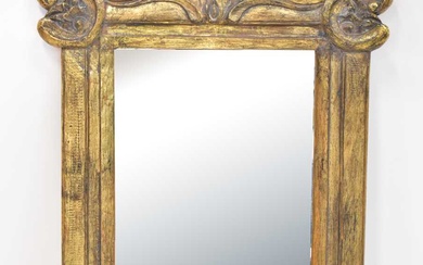 An Eastern carved gilt painted wooden wall-hanging mirror with Rococo-style...