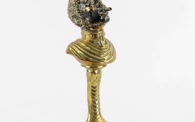 An antique Cigarette or Cigar lighter, polished bronze in the shape of a Blackamoor. 19th/20th C.