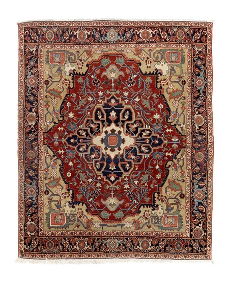 An antique Heriz rug, North West Persia. Executed with the finest sense of natural colour combination. C. 1900. 195×165 cm.