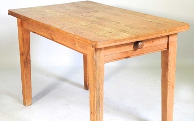An antique pine dining table, containing a single drawer, together...