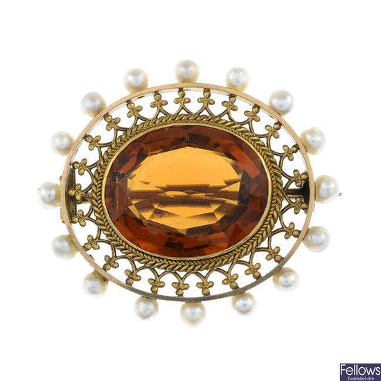 An early 20th century citrine and split pearl brooch.