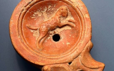 Ancient Roman Terracotta Exceptionally Well Preserved Elegantly Shaped Oil Lamp with an image of a Jumping Panther - .×5.5×7.8 cm
