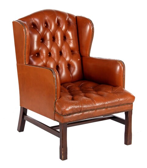 (-), Brown leather armchair with padded back and...