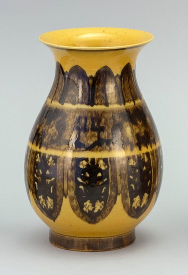 CHINESE BROWN AND YELLOW GLAZE PORCELAIN VASE In pear shape, with trumpet mouth and a fret and lappet design on body. Impressed six-...