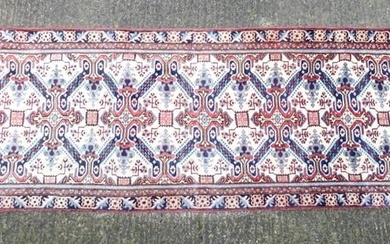 Carpet / Rug : A Persian Ardebil runner, the cream ground with floral and geometric repeating detail