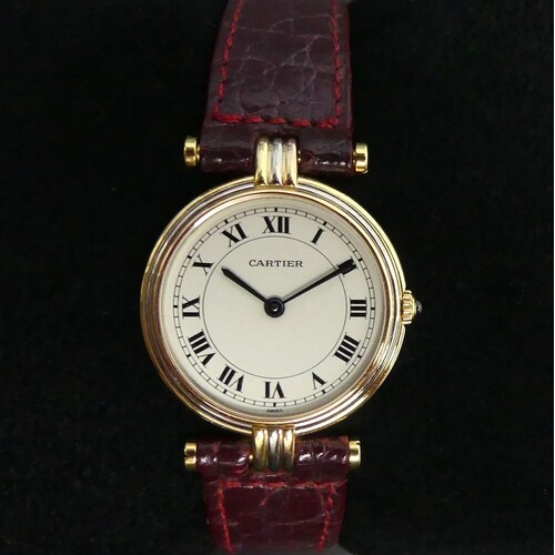 Cartier 18 carat tricolour gold quartz watch on a maroon lea...