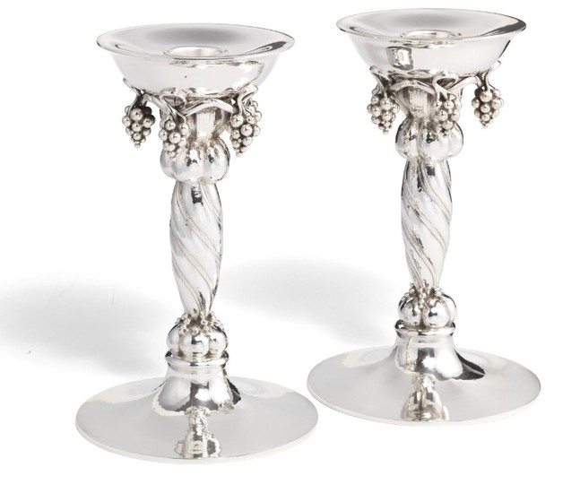 Georg Jensen: A pair of large sterling silver candlesticks with grapes. Spiral fluted stem and hammered surface. H. 20.5 cm. (2)