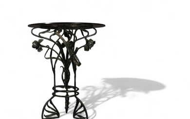 Glass table with floral wrought iron base, Art Nouveau period.