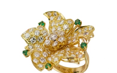 Gold 18K ring with seventy-seven diamonds and five emeralds.