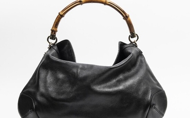 SOLD. Gucci: "Bamboo Peggy" A bag of black leather with gold tone hardware, a bamboo handle and a open compartment. – Bruun Rasmussen Auctioneers of Fine Art