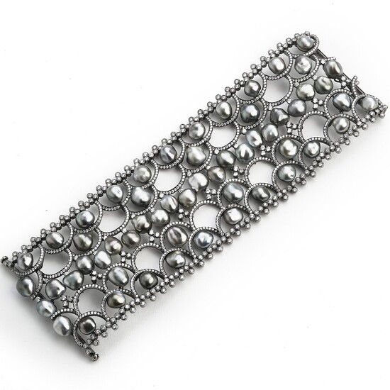 Hartmann's: A Tahiti pearl and diamond bracelet set with numerous cultured baroque Tahiti pearls and brilliant-cut diamonds, mounted in 18k white gold.