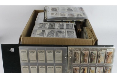 Large box containing a large quantity of sets mainly in page...