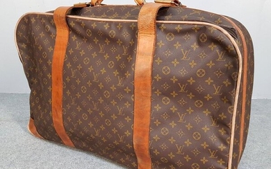 Louis VUITTON - CABINET in coated canvas with monograms decoration. 57 x 77 x 18 cm - wear and tear