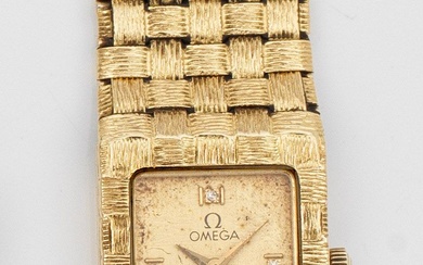 Montre-bracelet de dame Omega des années 1970 en or jaune, taille 750. Boîtier de montre...