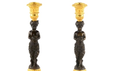 Pair of bronze, French candlesticks, in the form of fauns,...