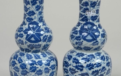 Pair of double-bottle vases in blue and white...