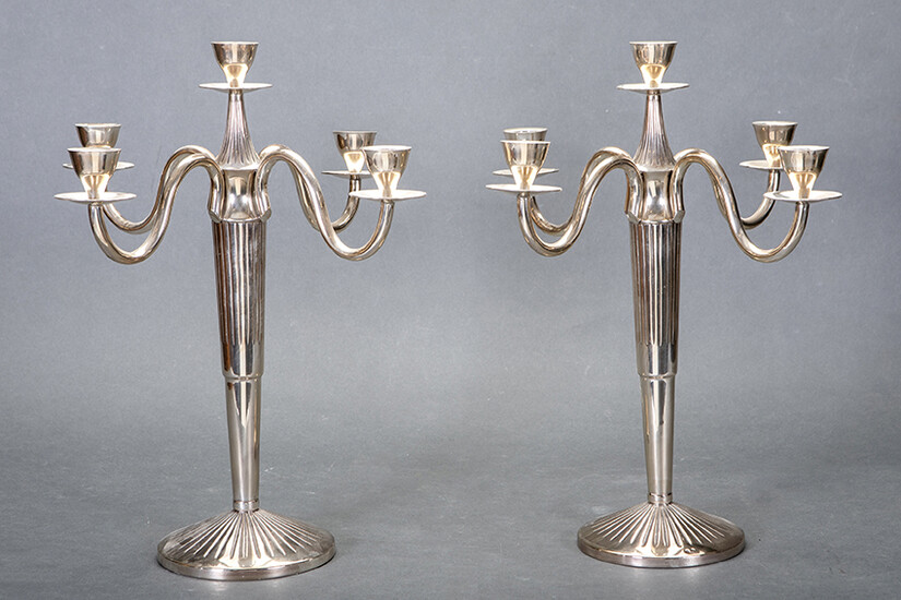 Pair of five-light candlesticks in punched Spanish silver with fluted decoration. Total weight: 1,600 Kg. approx. Height: 40 cm. Output: 500uros. (83.193 Ptas.)