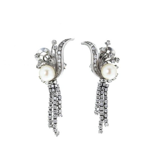 Pair of platinum and gold earrings with diamonds a
