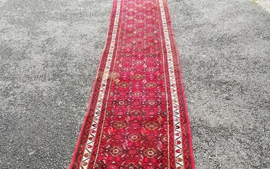 Persian red grounded hand woven wool rug / runner - 412cm x ...