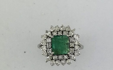 Ring in white gold 750°/°°° set with an emerald in a double entourage of round and shuttle diamonds, Finger size 54, Gross weight: 7,05g