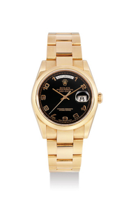 Rolex. A Pink Gold Bracelet Watch with Day and Date