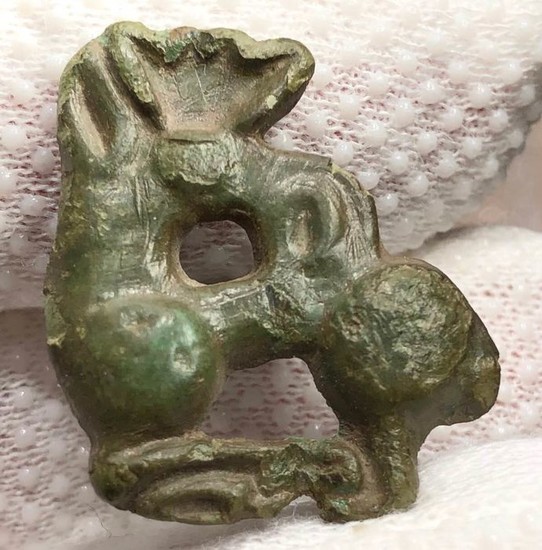 Scythian Bronze Applique shaped as a Mythological animal with a body of a Hind and Peacock Comb.