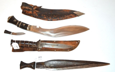 Set of three knives: one U.S., one African...