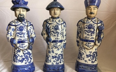 Set of three white and blue porcelain figures...