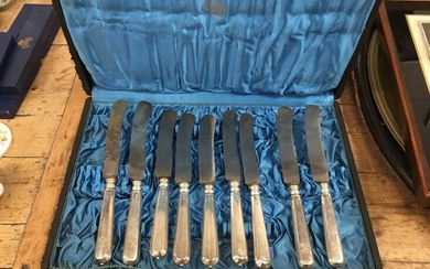 Set of twelve 19th century Continental white metal dinner knives with steel blades in fitted case