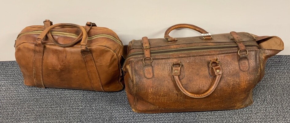 Two vintage leather bags, largest W. 53cm.
