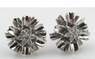 White gold (tests 18ct) diamond cluster flower earrings, eig...