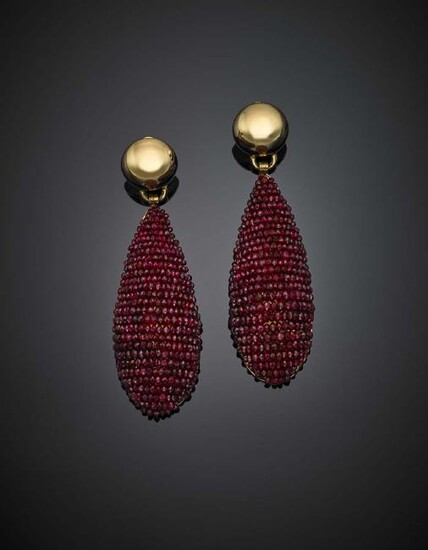 *Yellow gold pendant earrings accented with faceted red