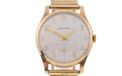GARRARD - a gentleman's 9ct yellow gold bracelet watch. View more details
