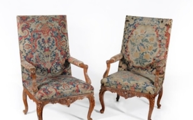 A pair of Régence carved oak and needlework upholstered armchairs