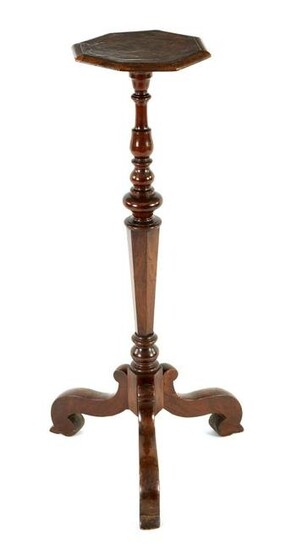 A 17TH CENTURY WALNUT TORCHERE with octagonal banded