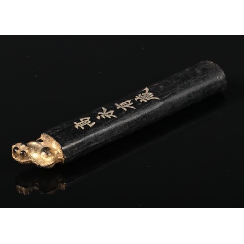 A 19th century Chinese calligraphy ink stick. With a gilt de...