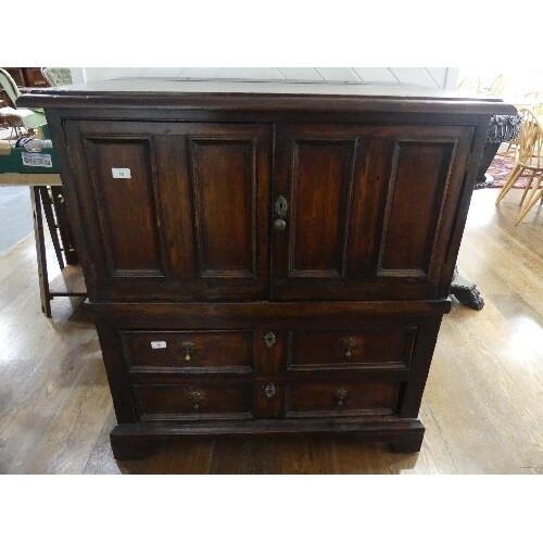 A 19th century oak Carolean style Panelled Chest, with two c...